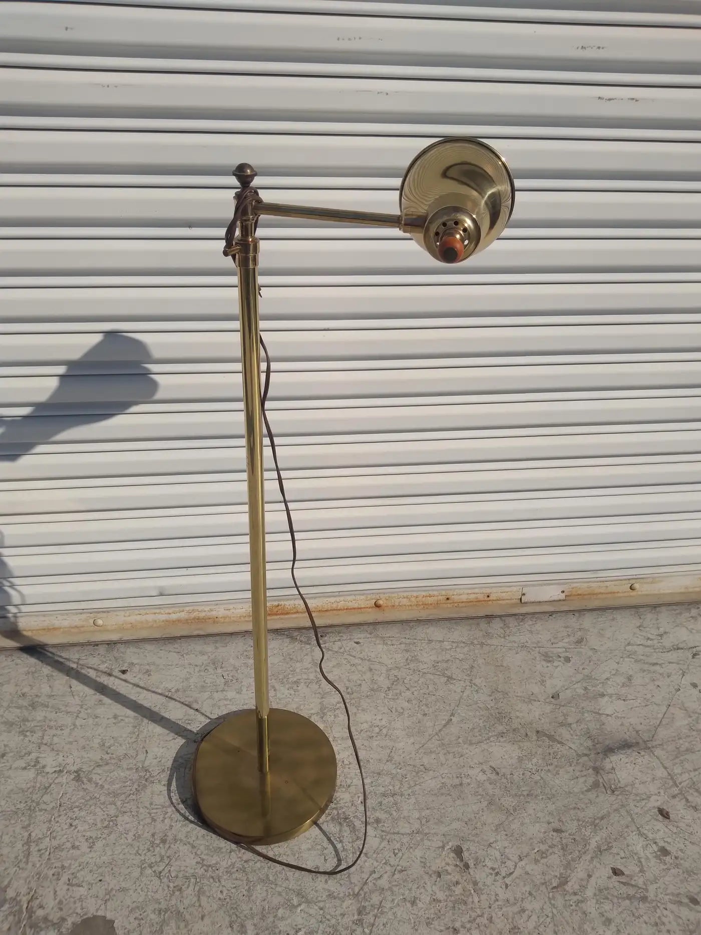 Elegant brass floor lamp with adjustable arm
