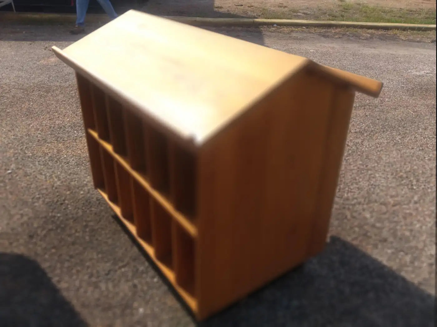 Slanted shelf unit with cubby compartments for storage