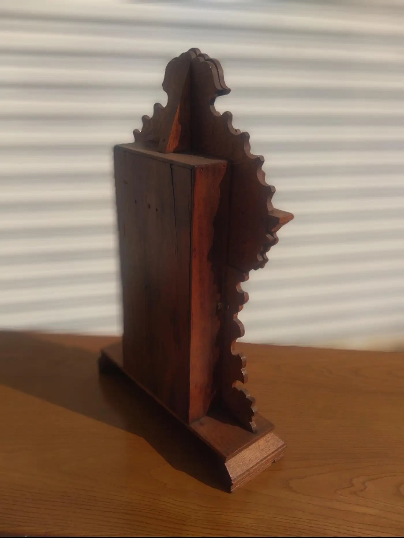 Antique walnut mantle clock with gingerbread design