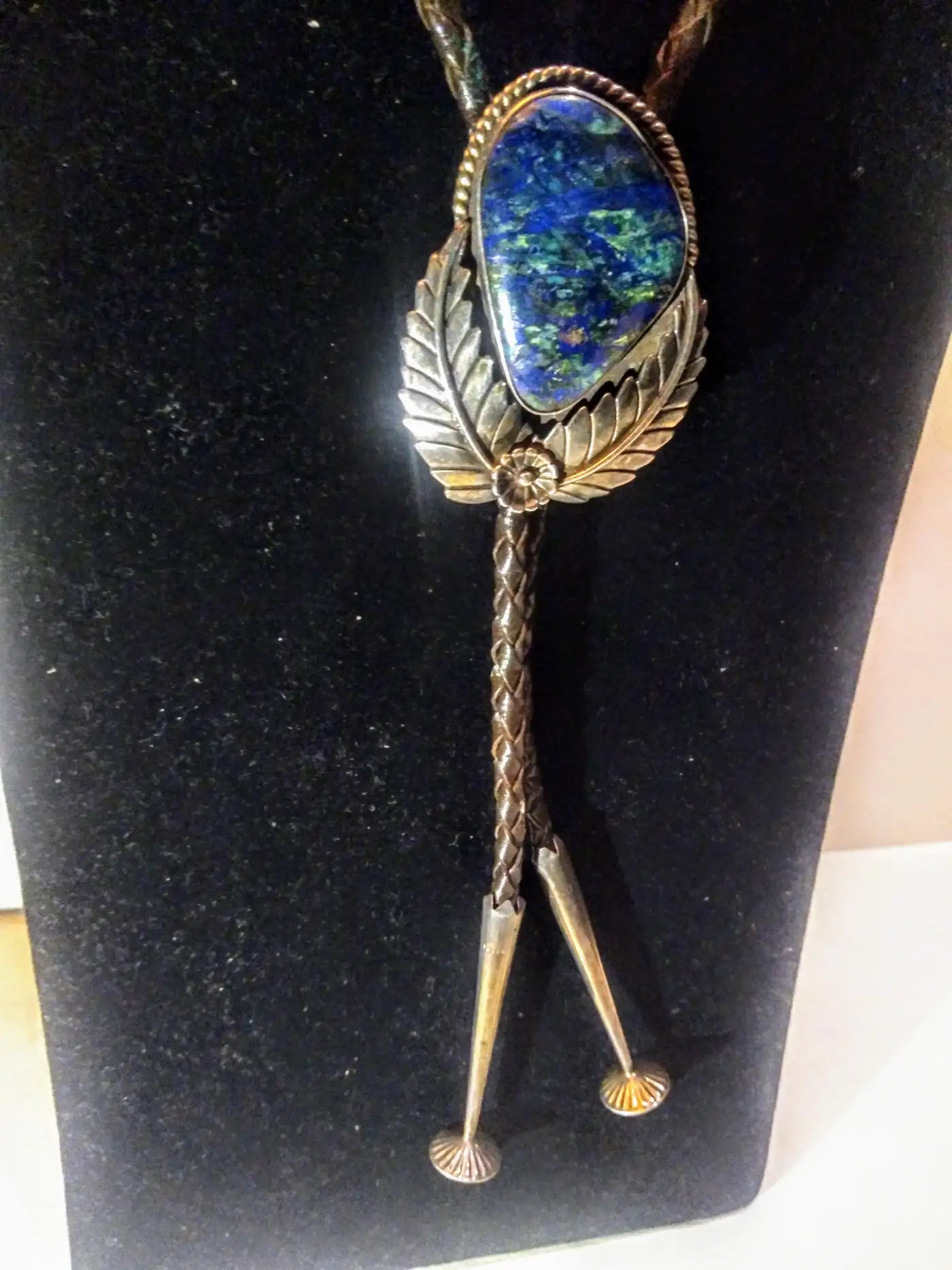 38-inch leather bolo tie with blue opal and sterling silver medalli