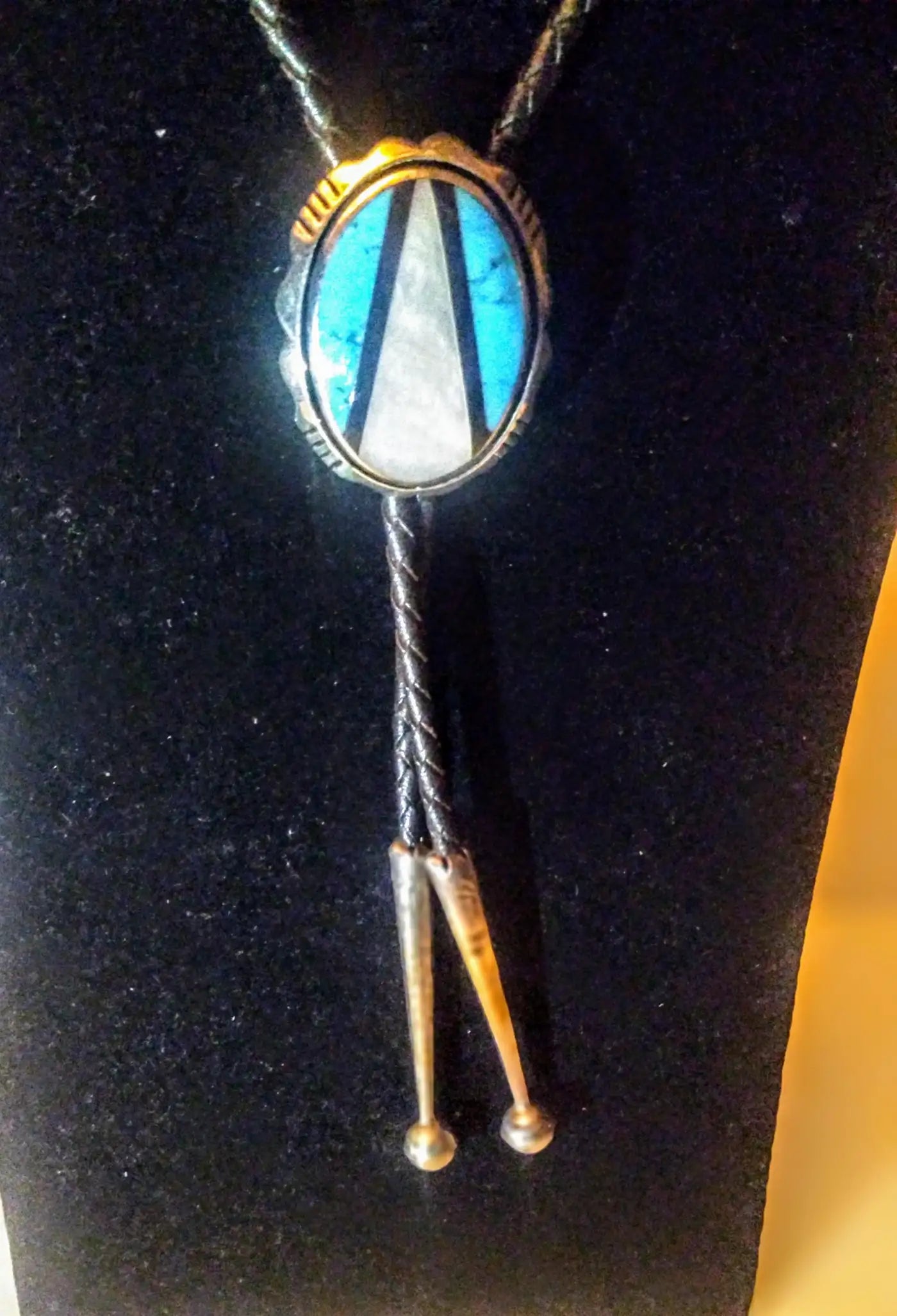 Sterling Navajo bolo tie featuring turquoise medallion