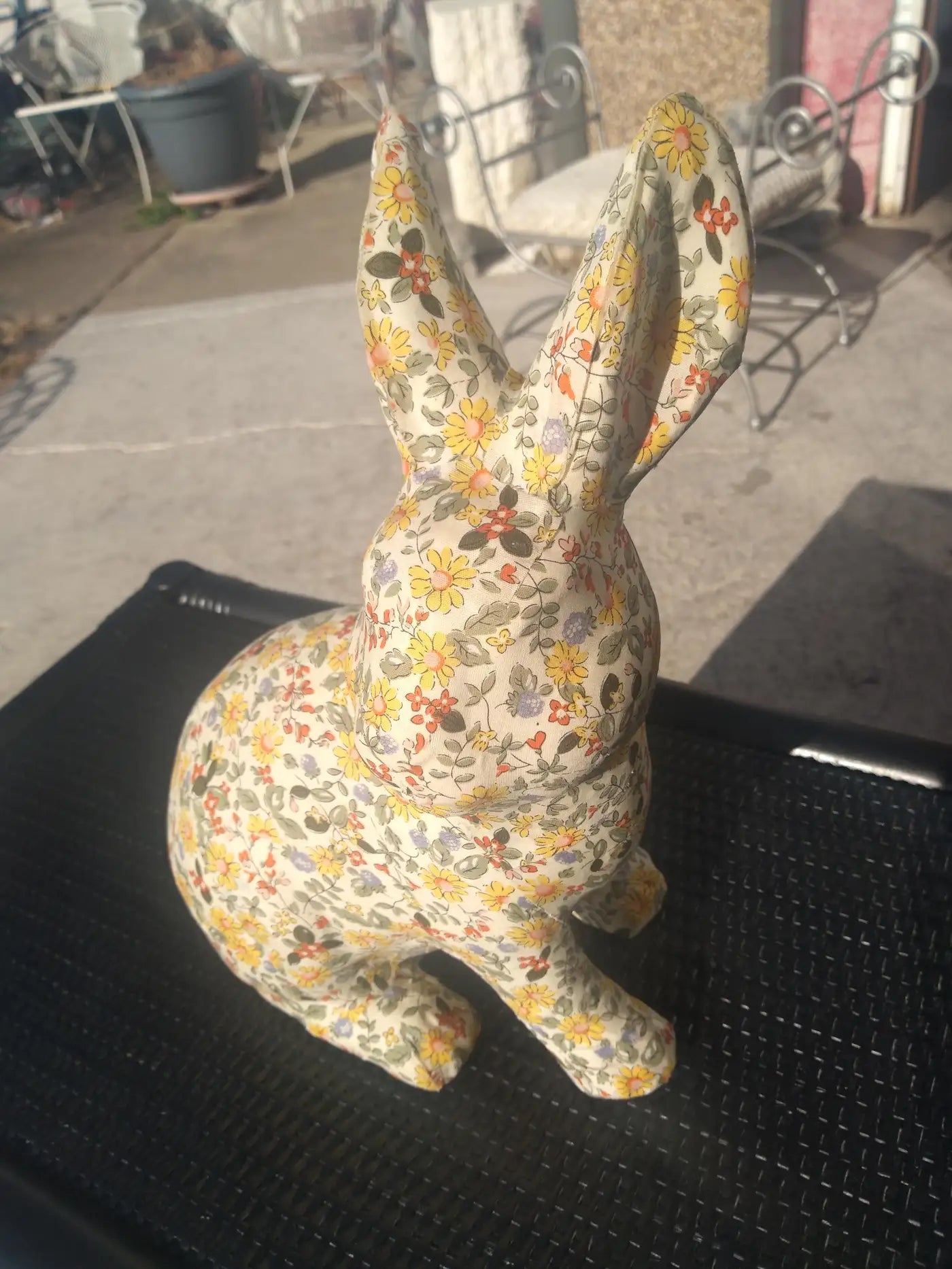 Whimsical textile-covered rabbit statue