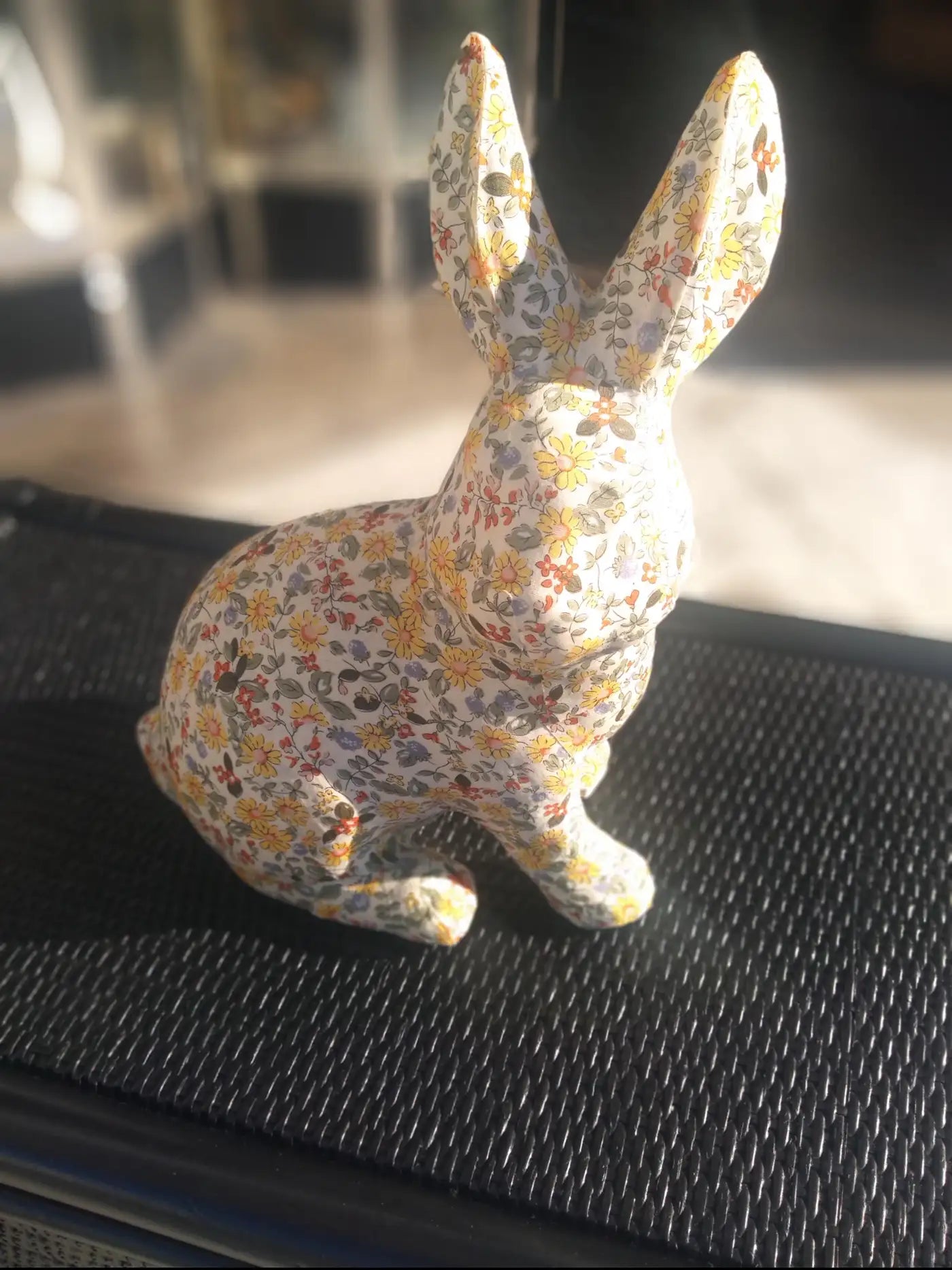 Soft sculpture of a rabbit in fabric wrap