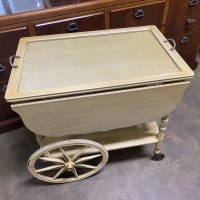 Vintage wooden serving cart with drop-leaf design