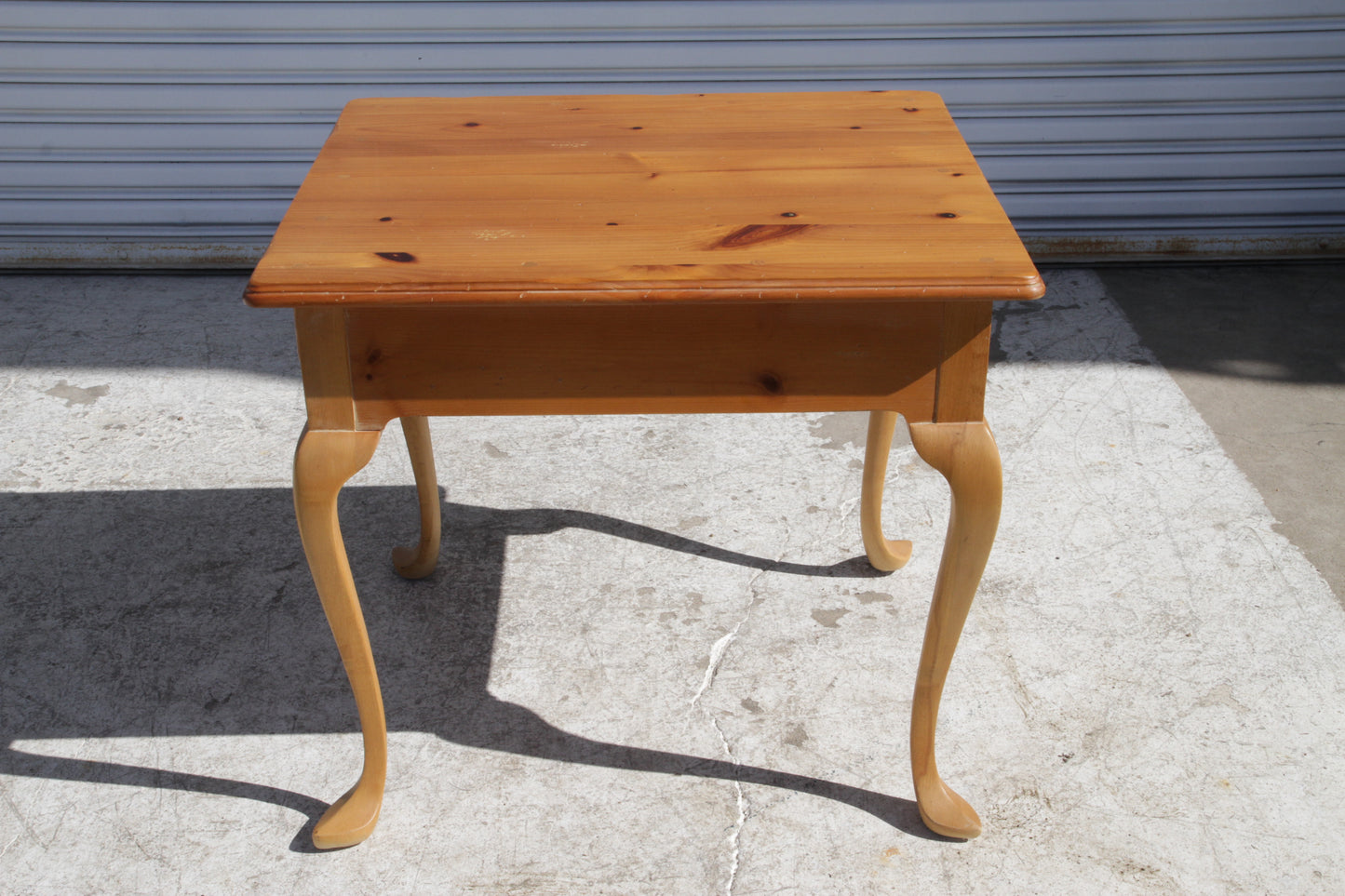 Curved leg side table by Metro Retro Furniture for outdoor settings