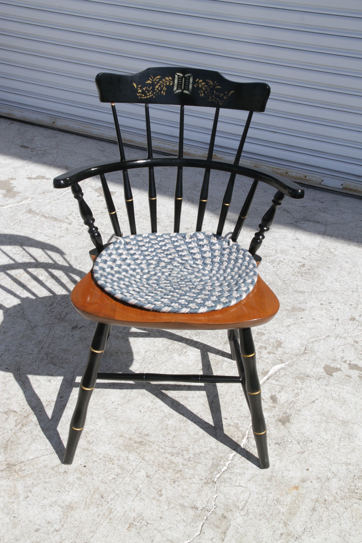 Traditional spindle back Windsor chair for dining rooms, kitchens, or rustic spaces.