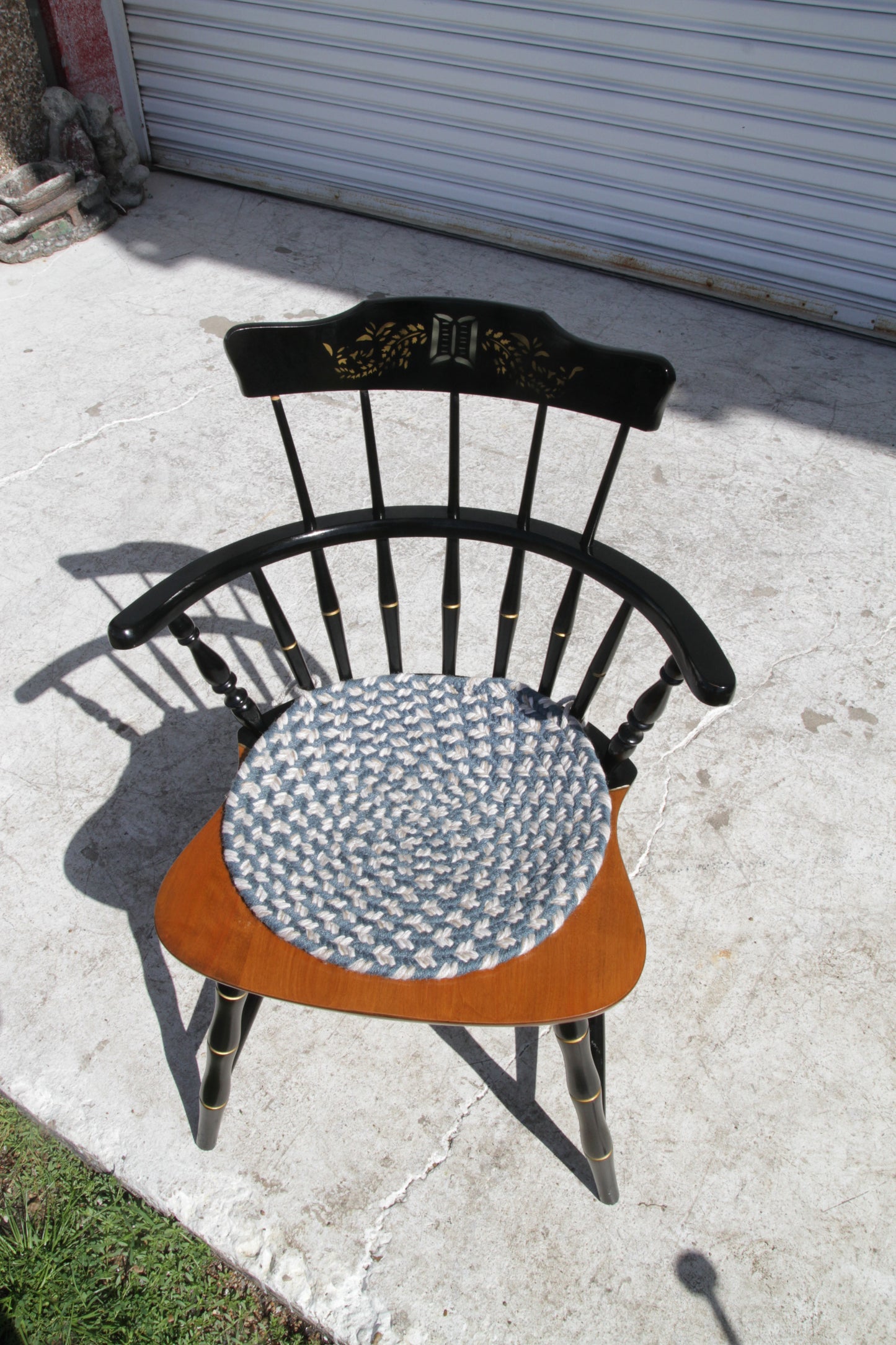 Black spindle back Windsor chair, perfect as a dining chair or accent piece.