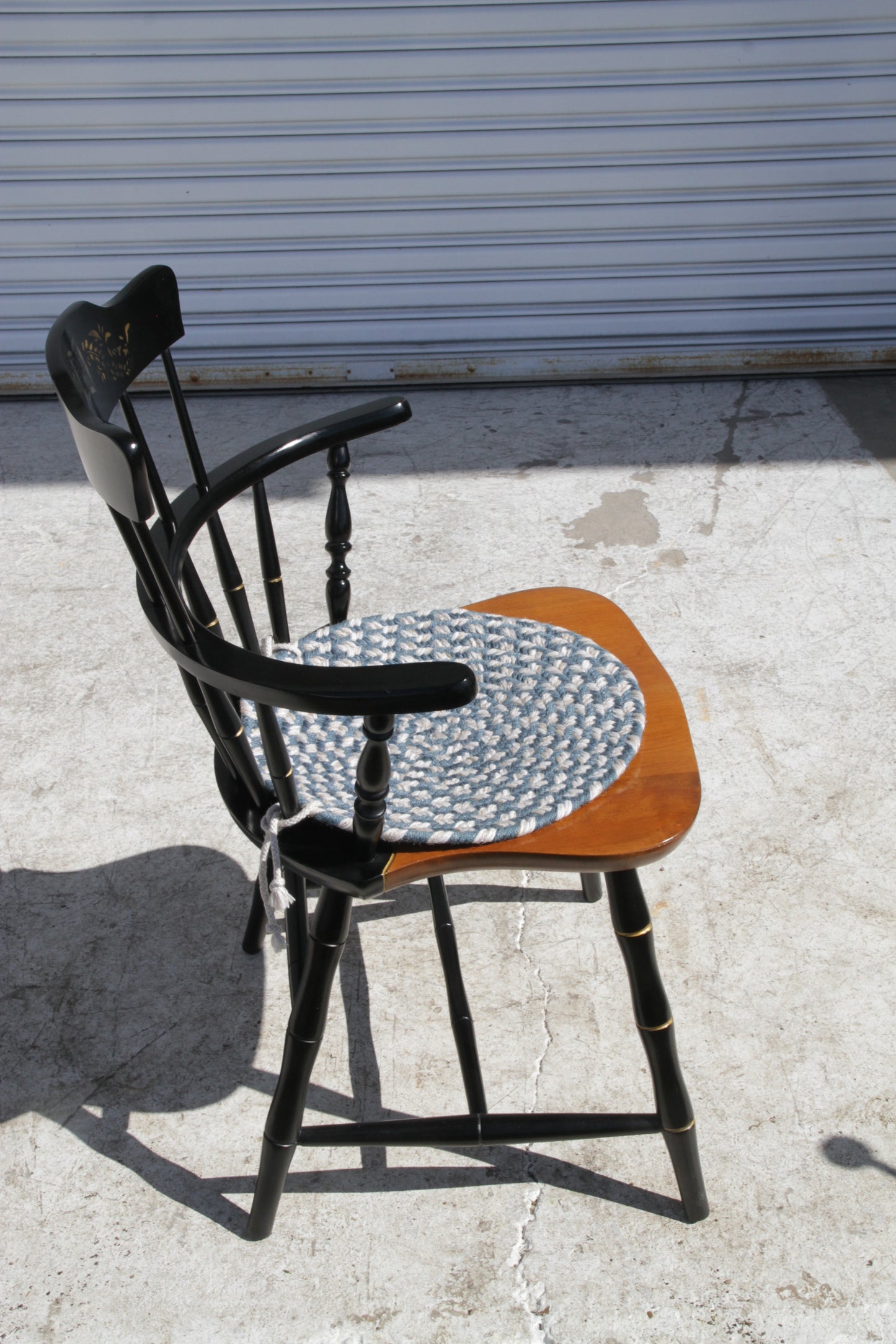 Metro Retro Furniture’s Windsor dining chair with black spindle back and wood seat.