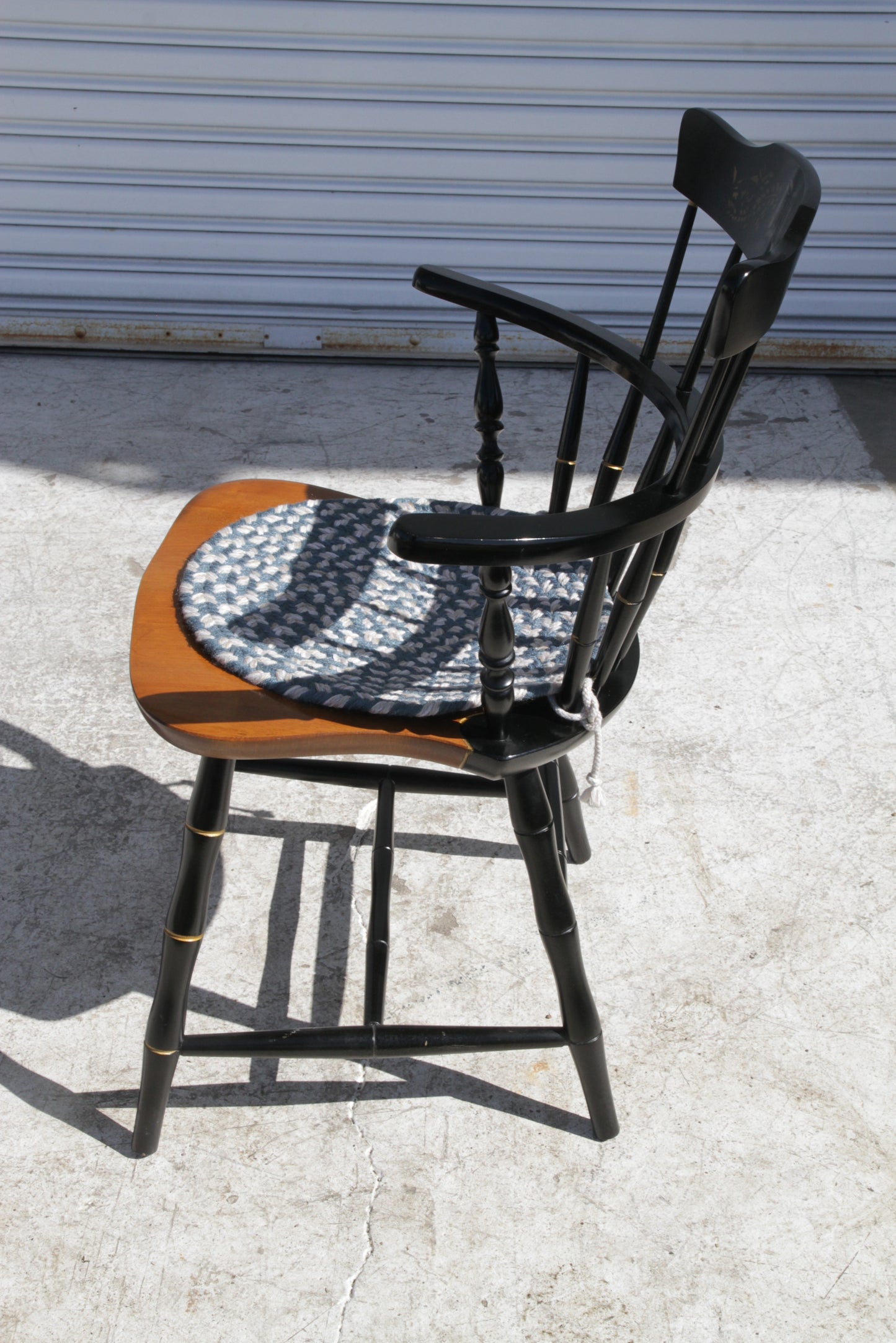 Handcrafted Windsor chair with wooden seat and spindle back, country style charm