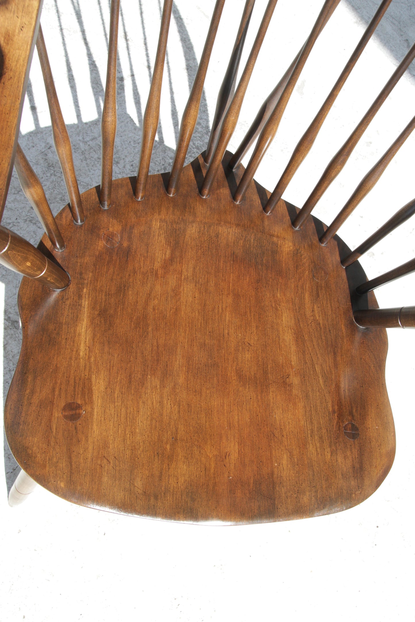 Elegant Windsor dining chair with curved arms and spindle back detail