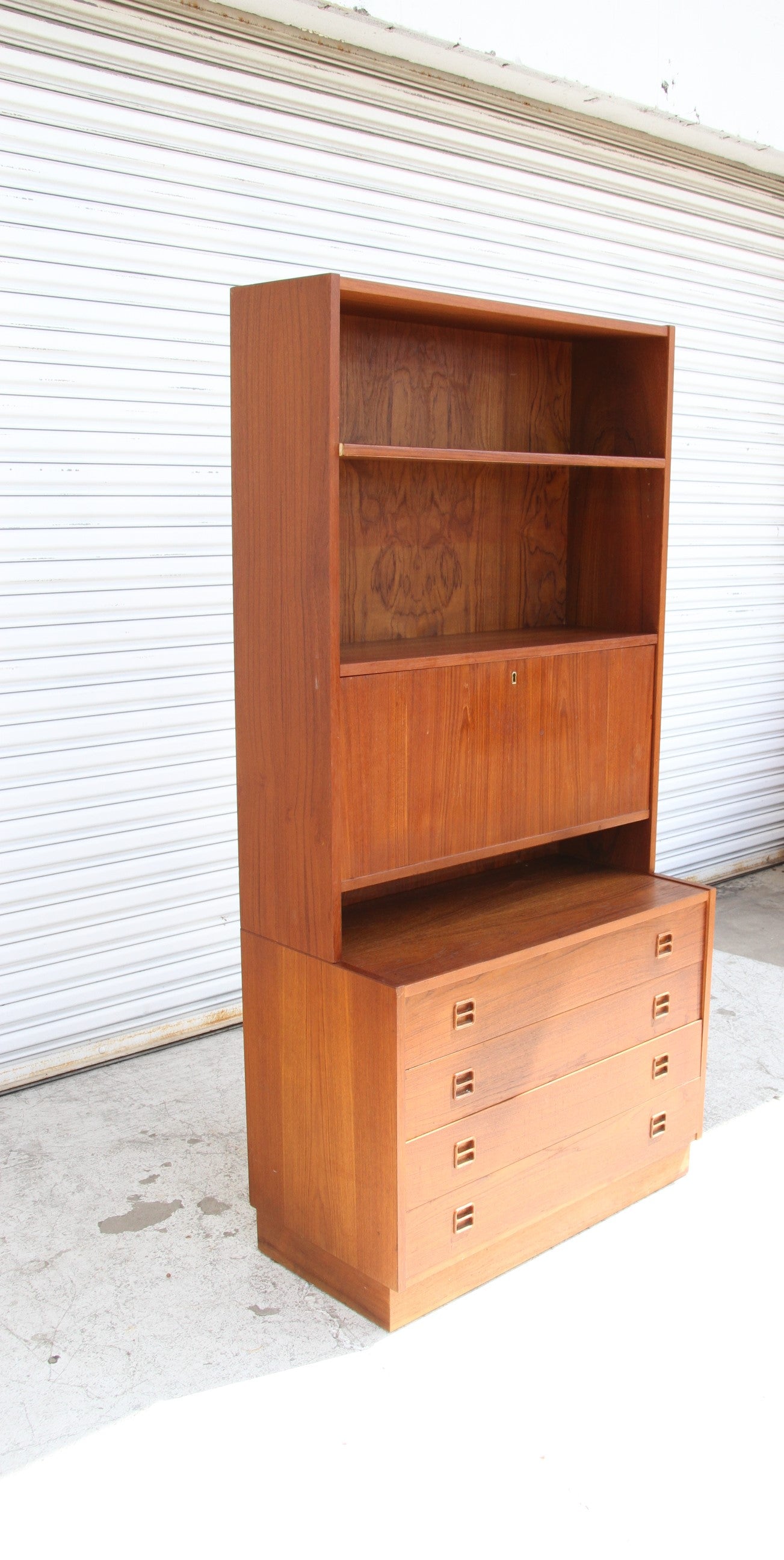 Wooden chest of drawers combined with a compact desk with drawers
