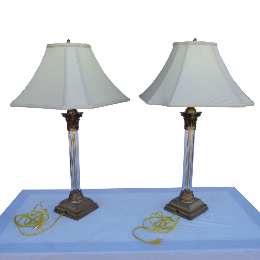 Crystal lamps with fluted columns and ornate brass accents