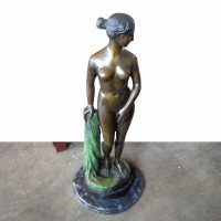tall bronze sculpture of draped lady