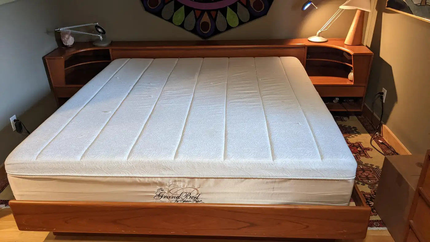 Elegant mid century bed with wood nightstands