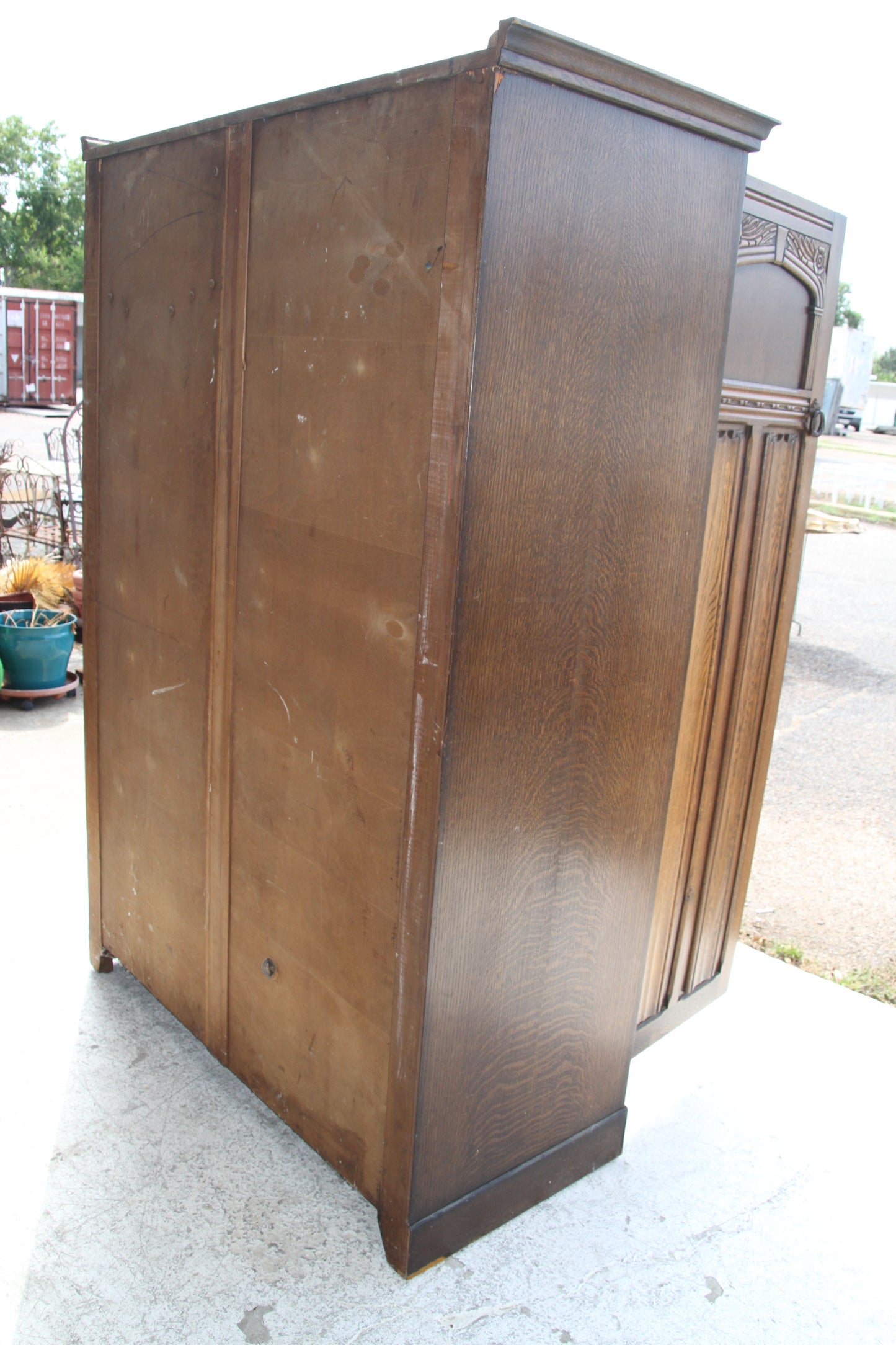 Indulge in the timeless beauty of this vintage imported London wardrobe armoire. This antique furniture piece offers ample storage with classic charm.