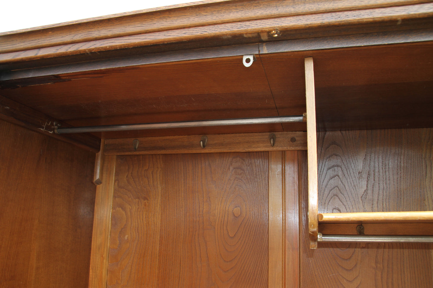 Experience the elegance of British craftsmanship with this vintage imported London wardrobe armoire. A stunning antique closet that elevates any room.