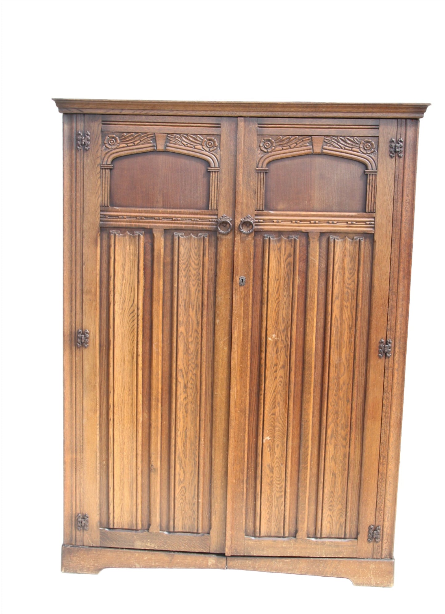 Discover the charm of British design with this vintage imported London wardrobe armoire. A beautiful antique closet that adds character to any space.