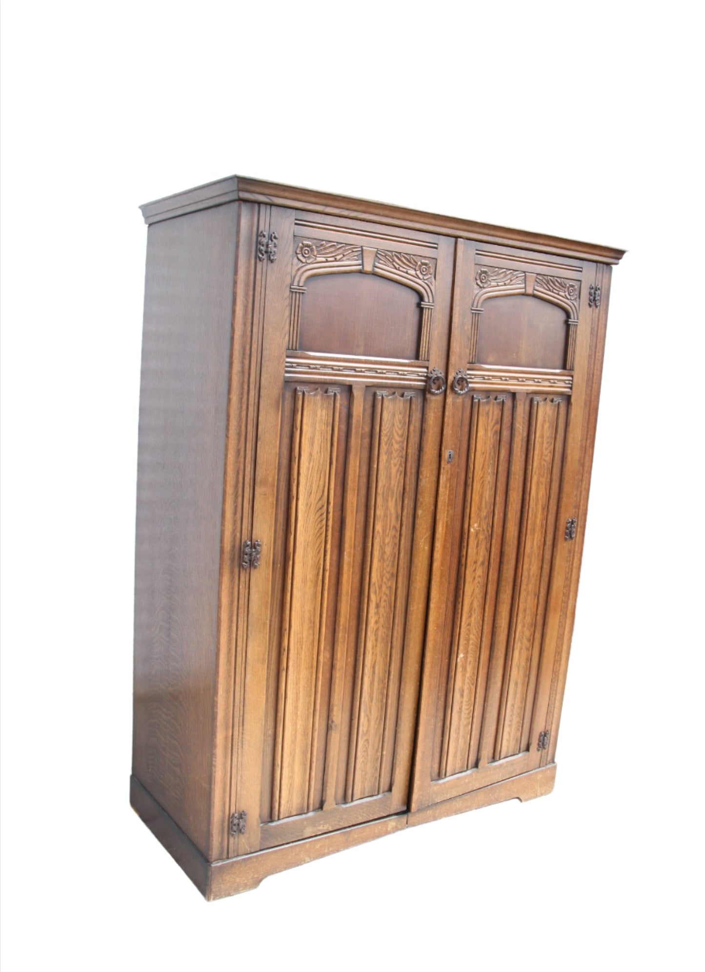 Bring a piece of history into your home with this vintage imported London wardrobe armoire. This antique storage cabinet is a true statement piece.