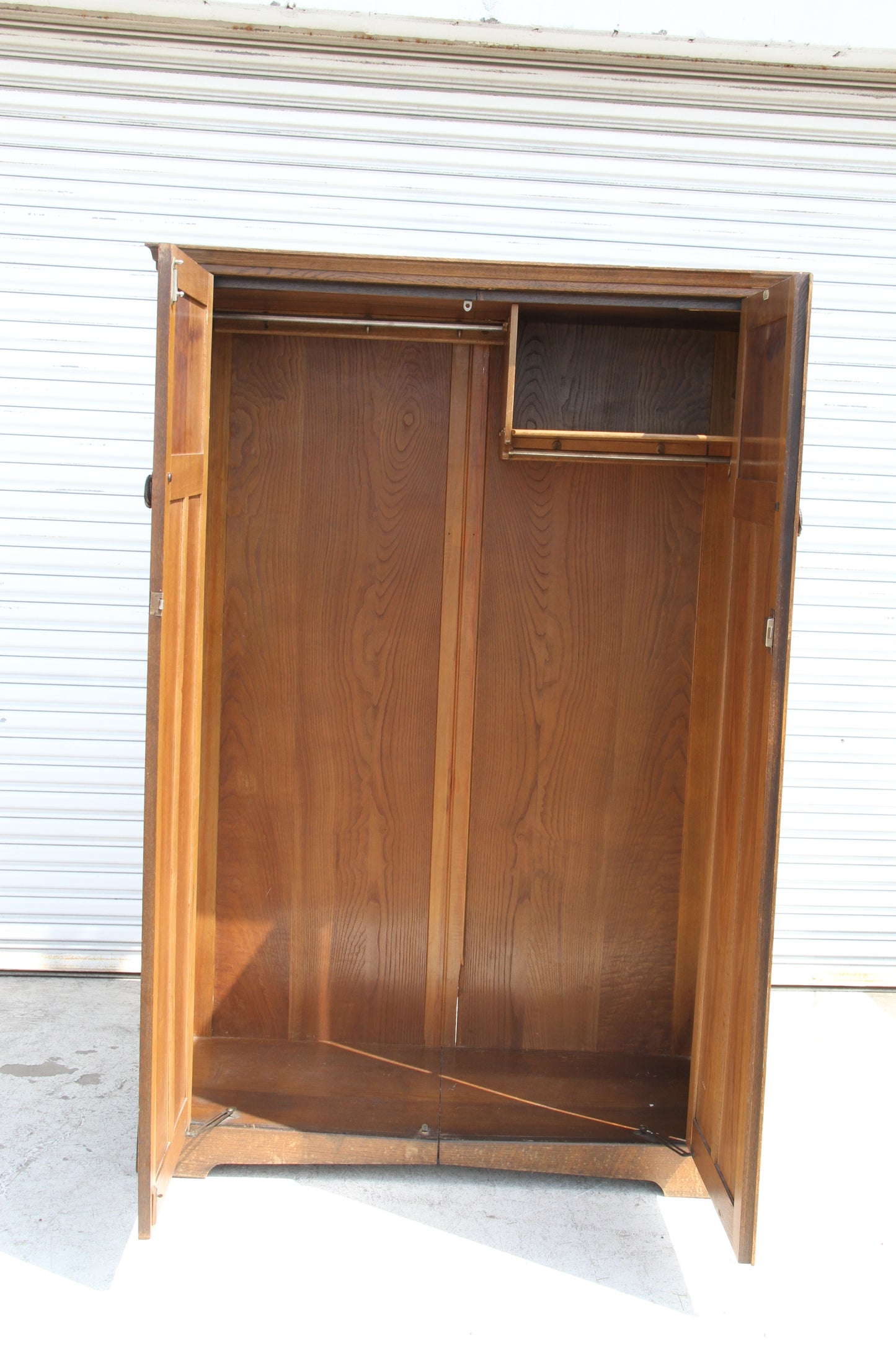 vintage imported London wardrobe armoire. This antique cabinet offers ample space with a touch of classic charm.