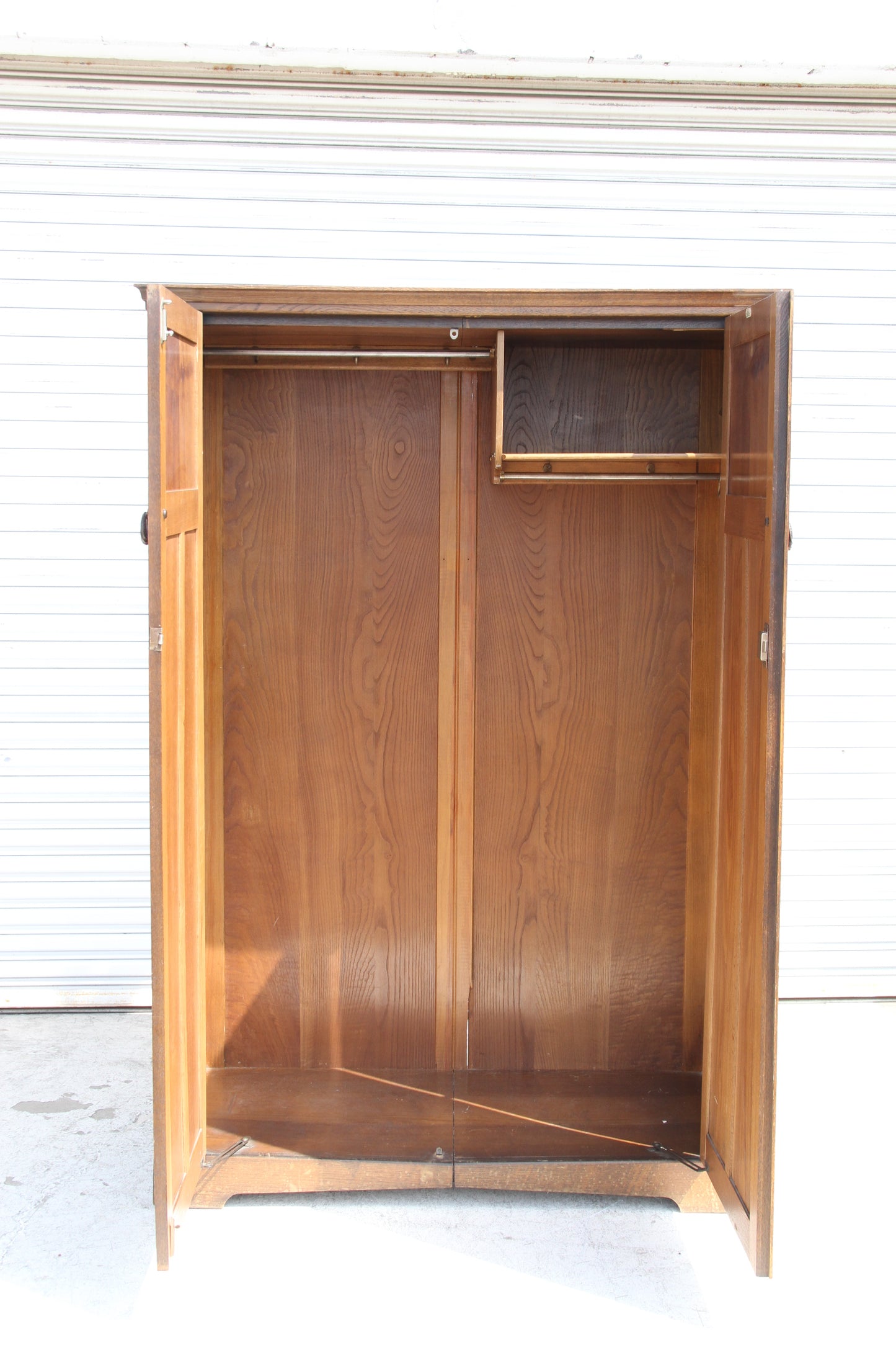 British design in this vintage imported London wardrobe armoire. A stunning antique closet that adds character to your home.
