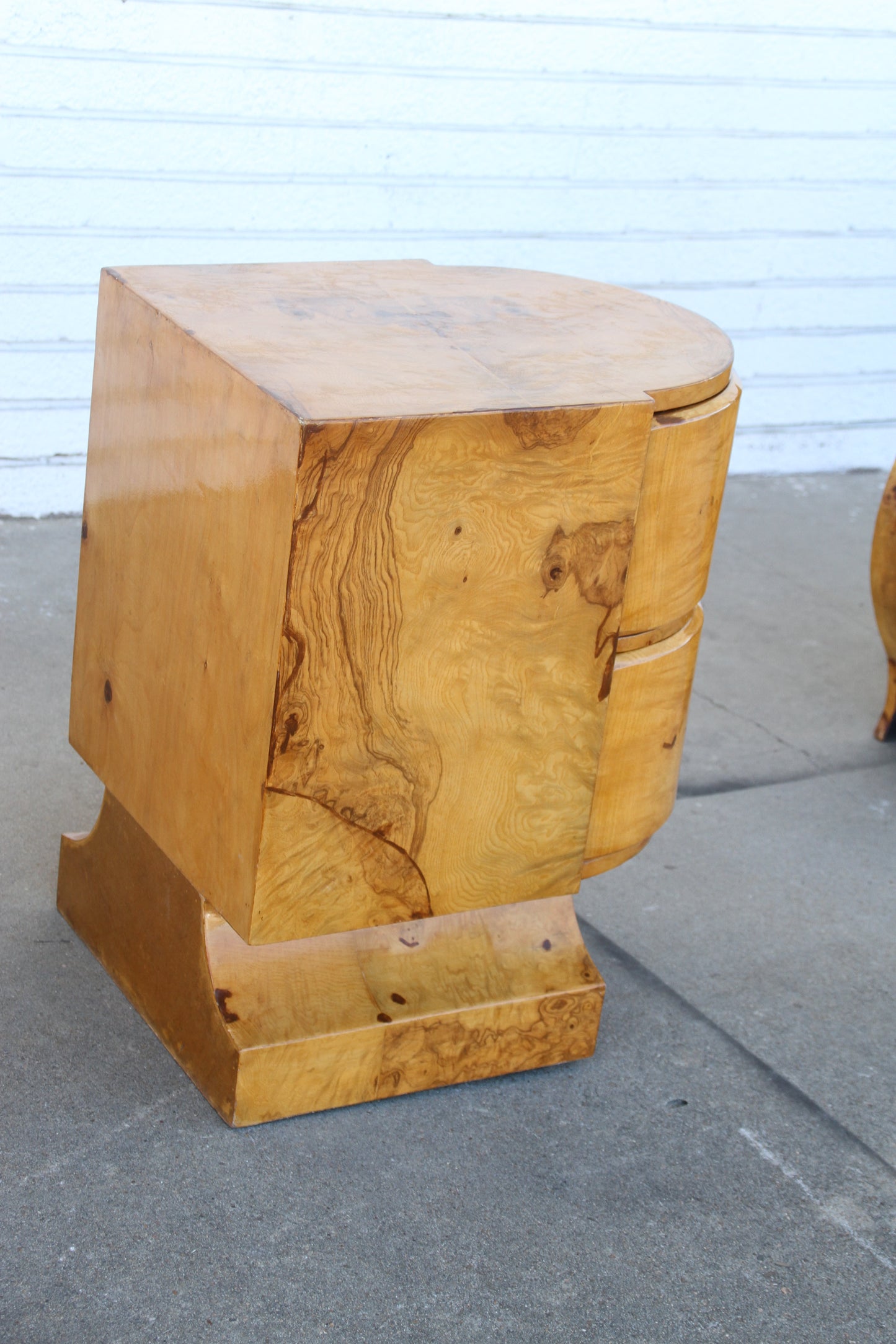 Drawer detail on burled wood nightstand