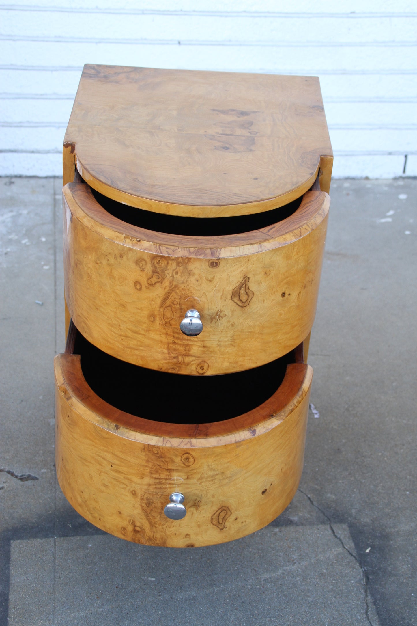 Side view of Art Deco nightstands in burled finish