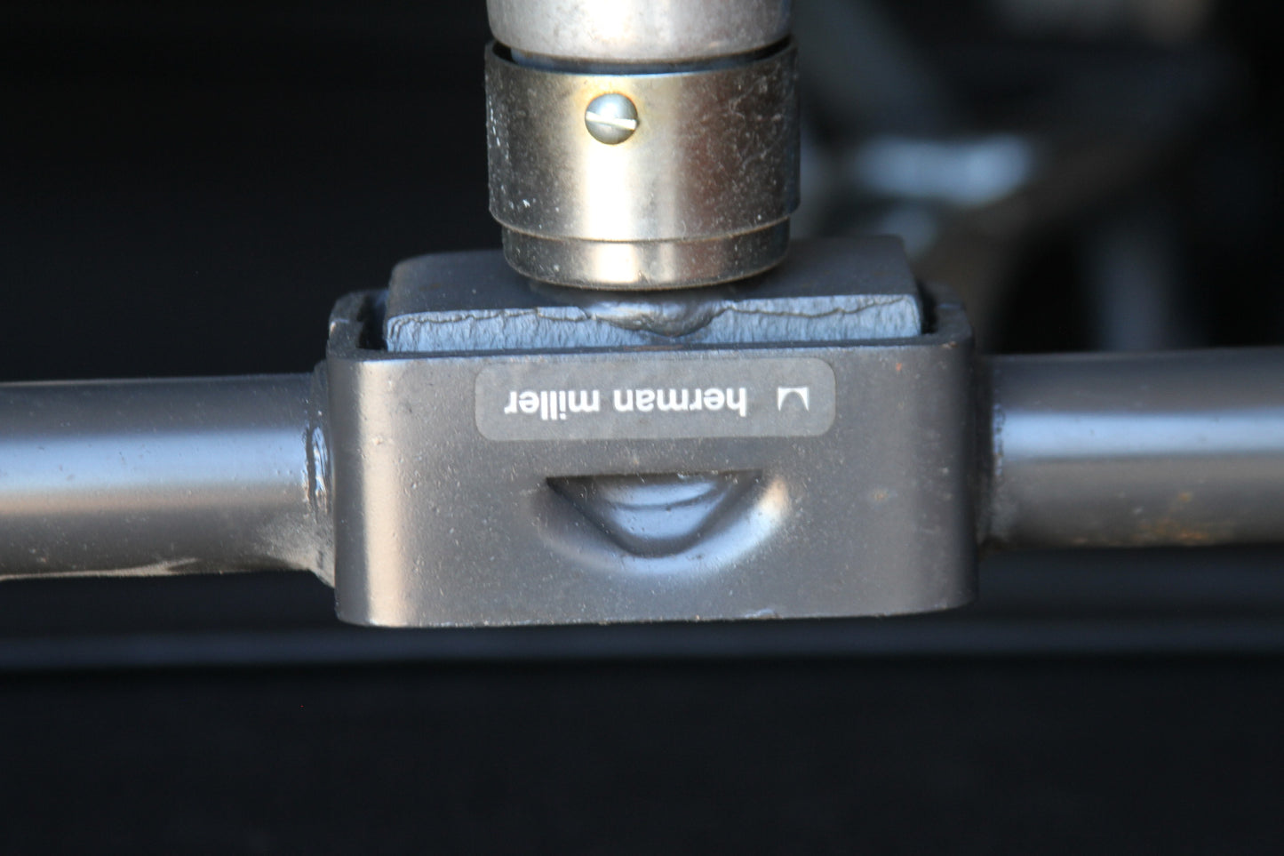 The black leather Eames Soft Pad lounge chair offers both elegance and comfort. With its ergonomic design and luxurious soft pad cushions, it enhances any contemporary interior.