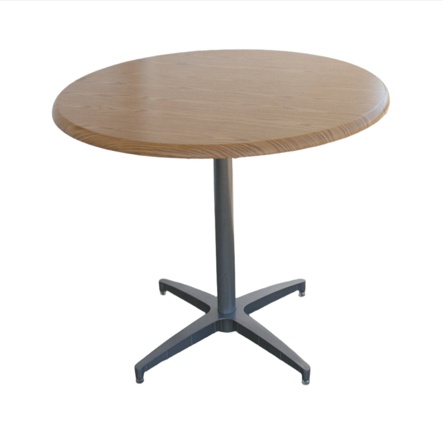 42" Herman Miller Laminate Round Dining Table. Its sleek design and easy-to-maintain laminate surface make it an ideal centerpiece.