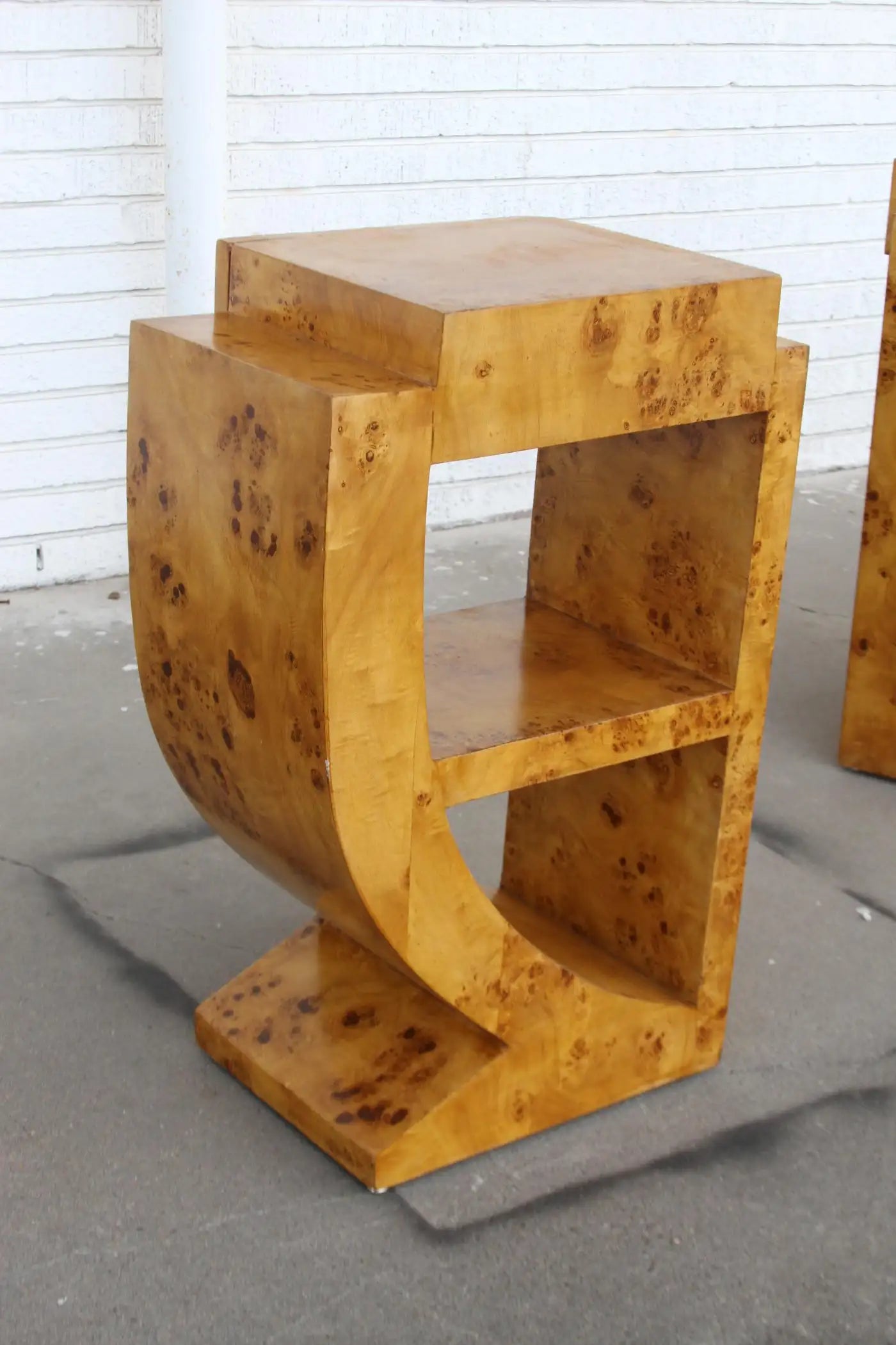Elegant Art Deco single drawer nightstands in burl