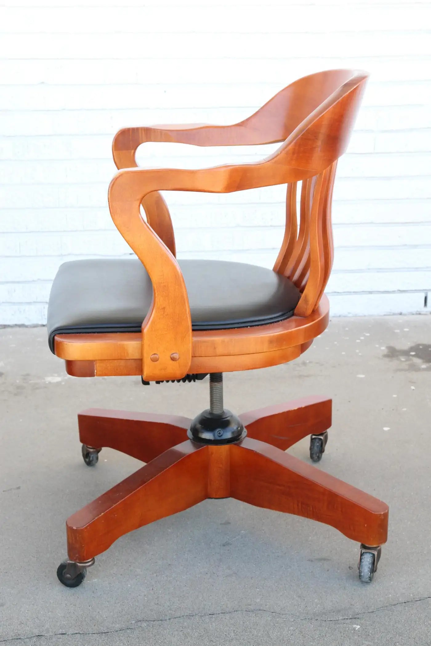 Vintage cherry banker swivel chair on casters