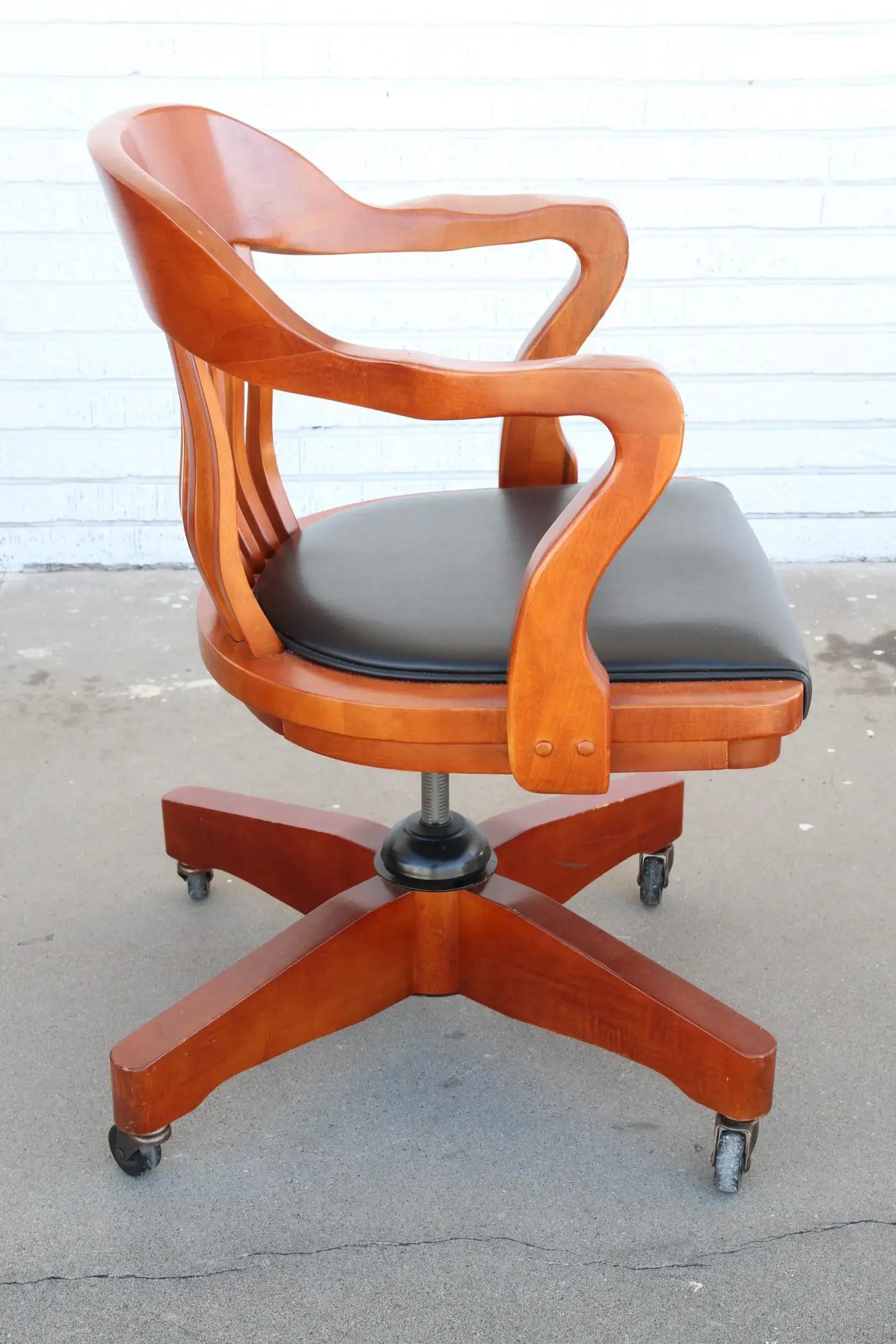 Classic cherry swivel chair for office decor