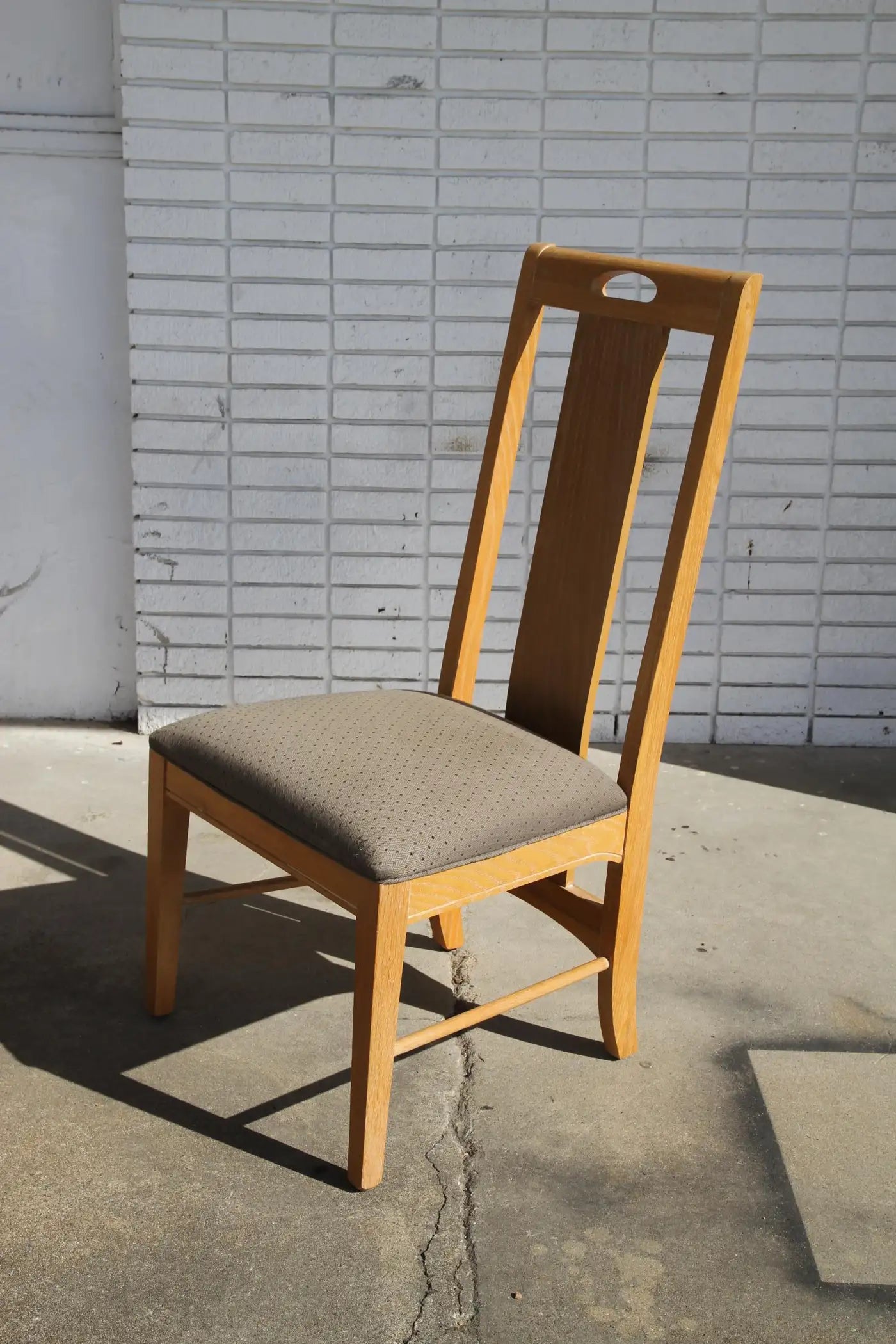 Classic oak dining chairs with wood grain detail