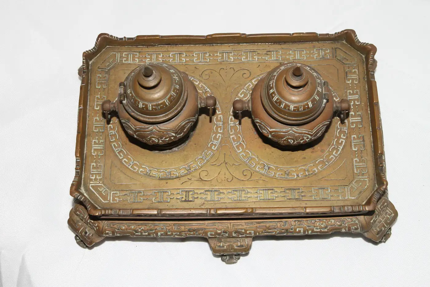 Old-fashioned desk accessory with brass filigree design