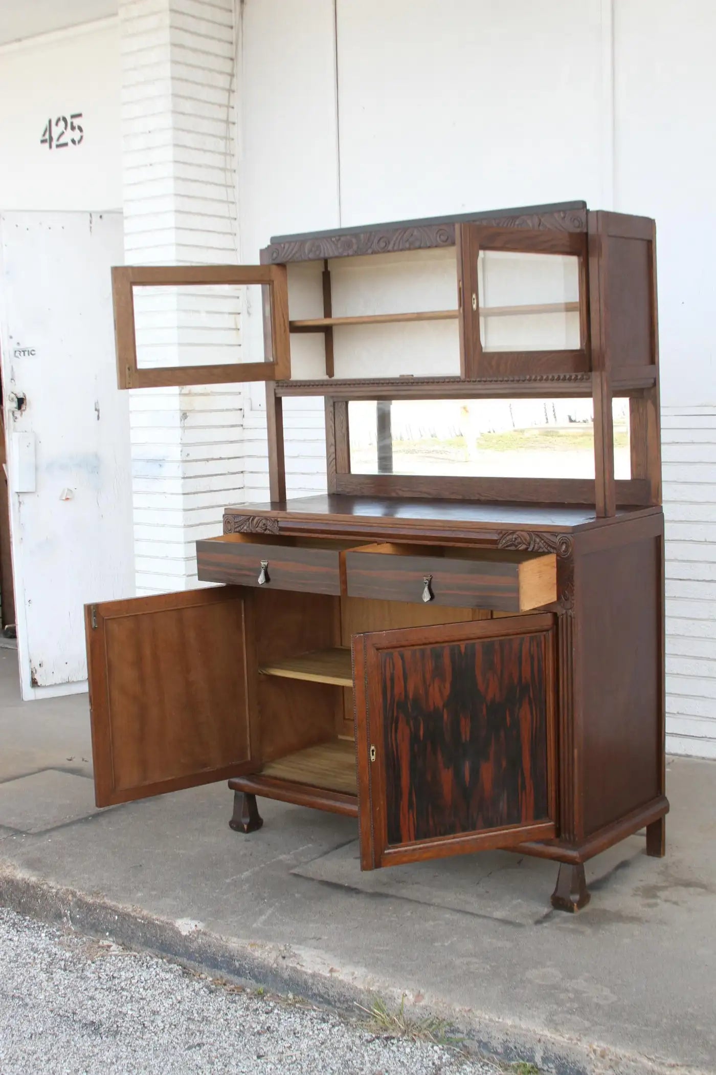 Ornate wood buffet with mirror backing