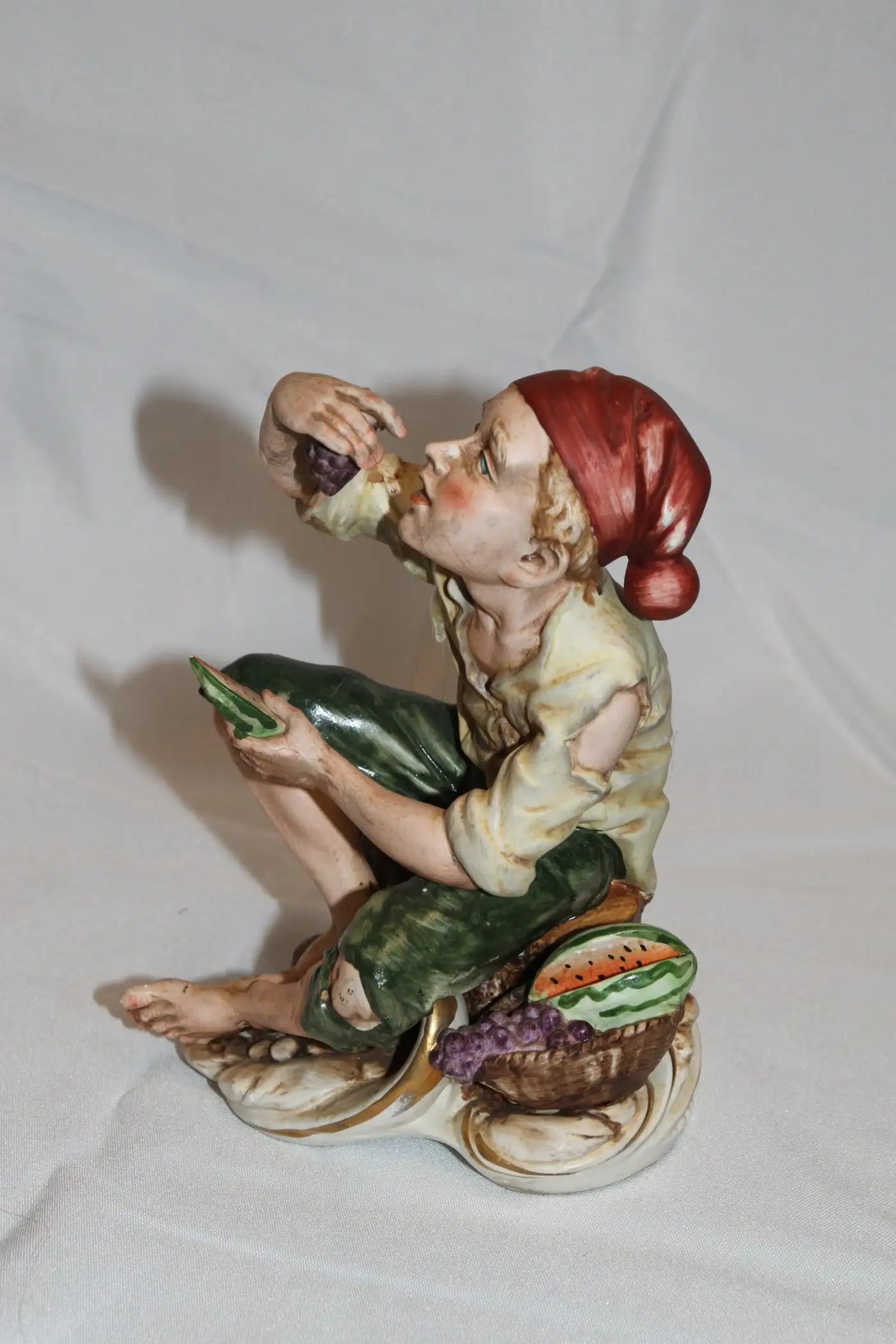 Decorative sculpture of man with grapes