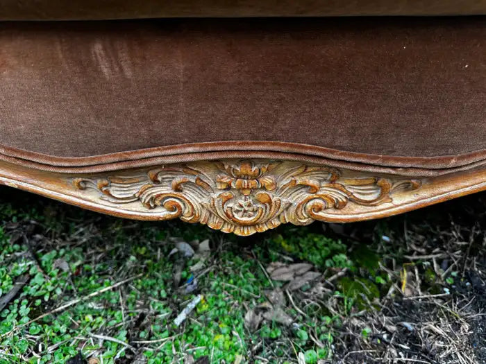 Classic Louis XV sofa showcasing detailed wood craftsmanship