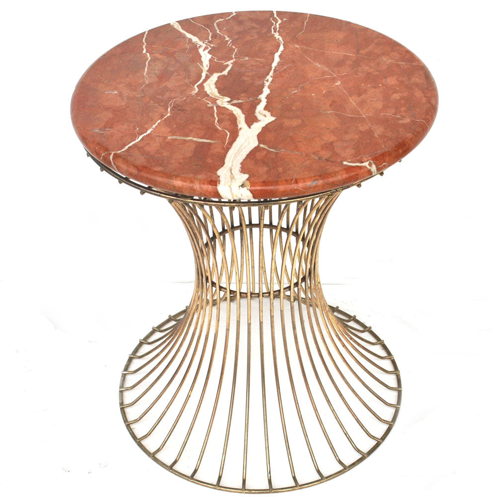 Modern accent table featuring integrated planter and elegant marble surface