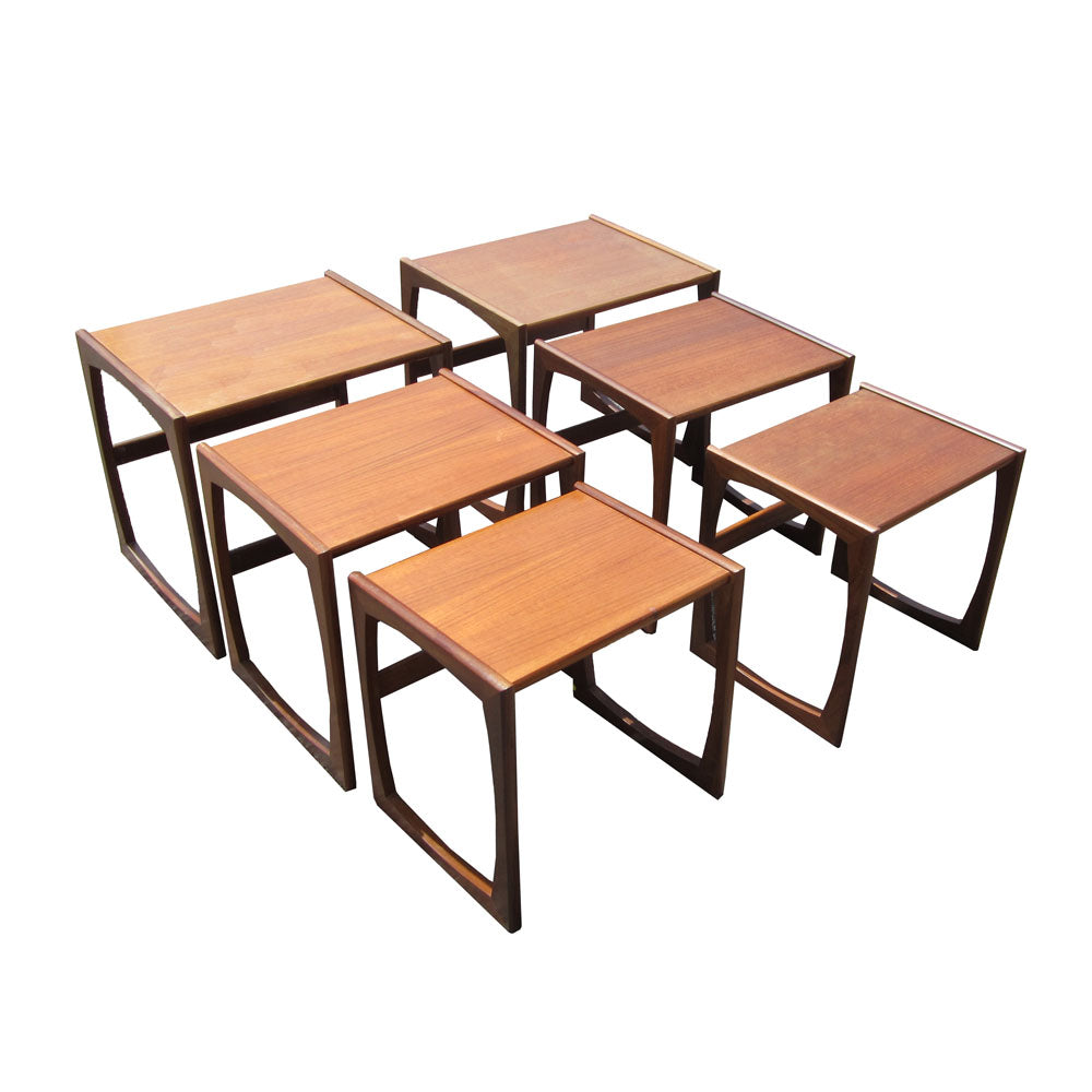 Teak nesting tables set in midcentury modern vintage style