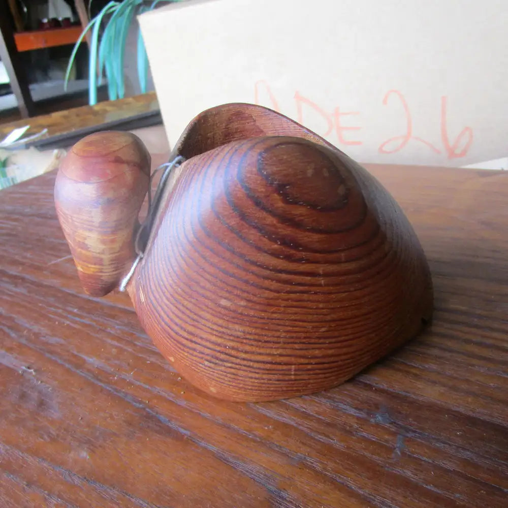 Side view of teak wood duck sculpture by Deborah Bump