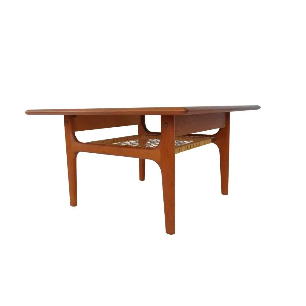 Vintage Danish side table featuring cane shelf