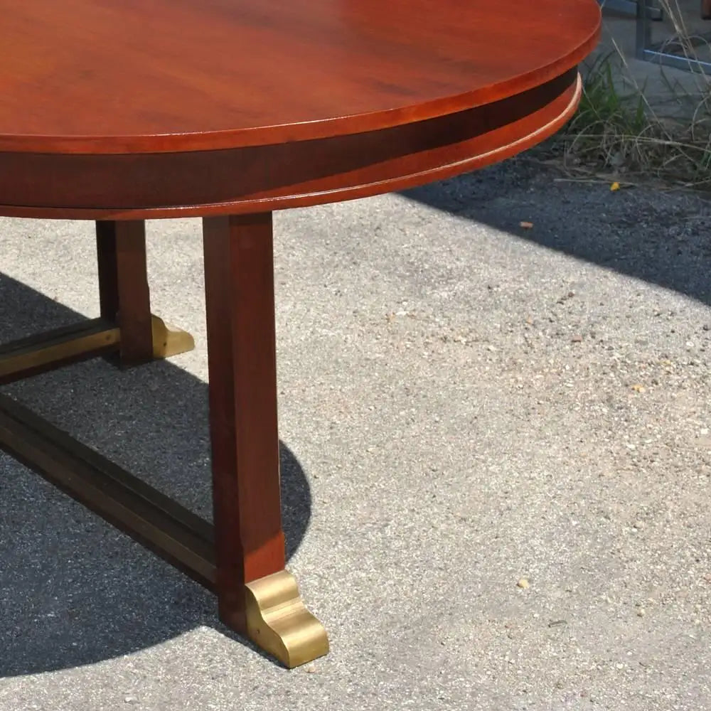 Vintage meeting table with oval top and carved base