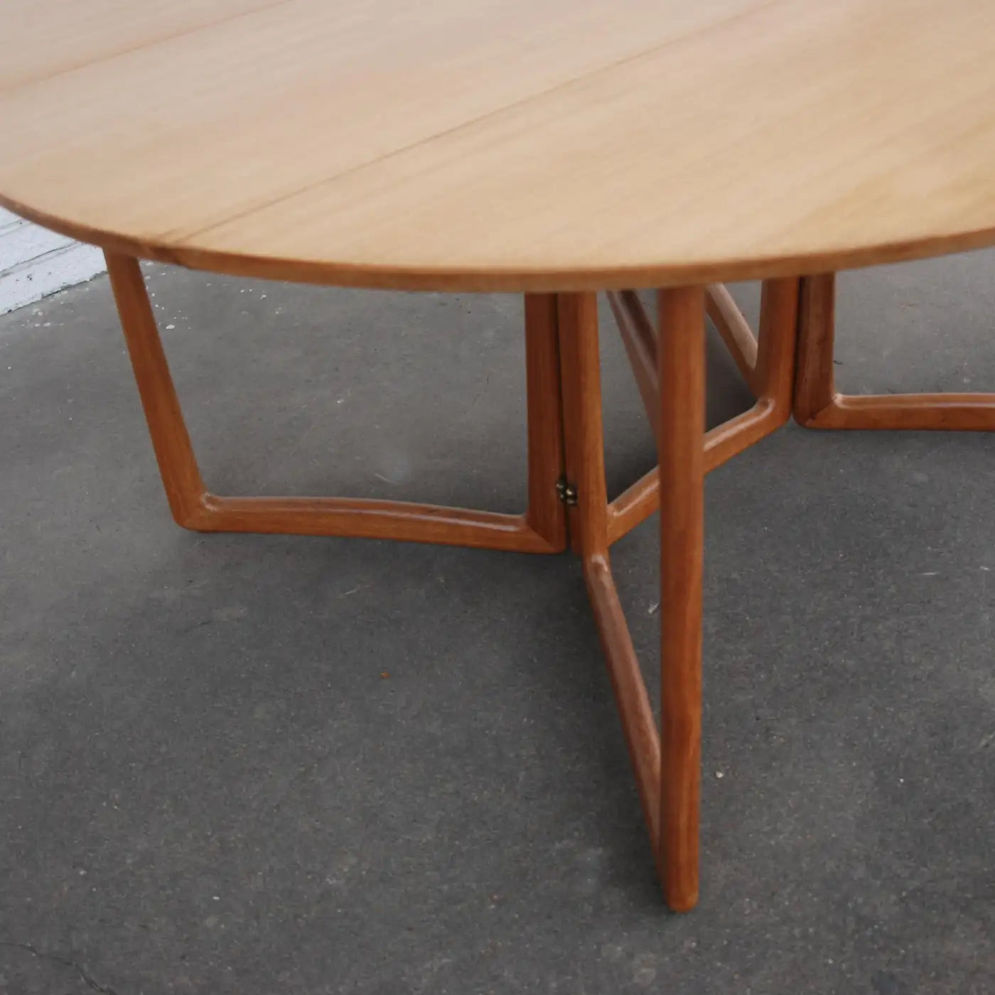 Elegant teak dining table with brass accents