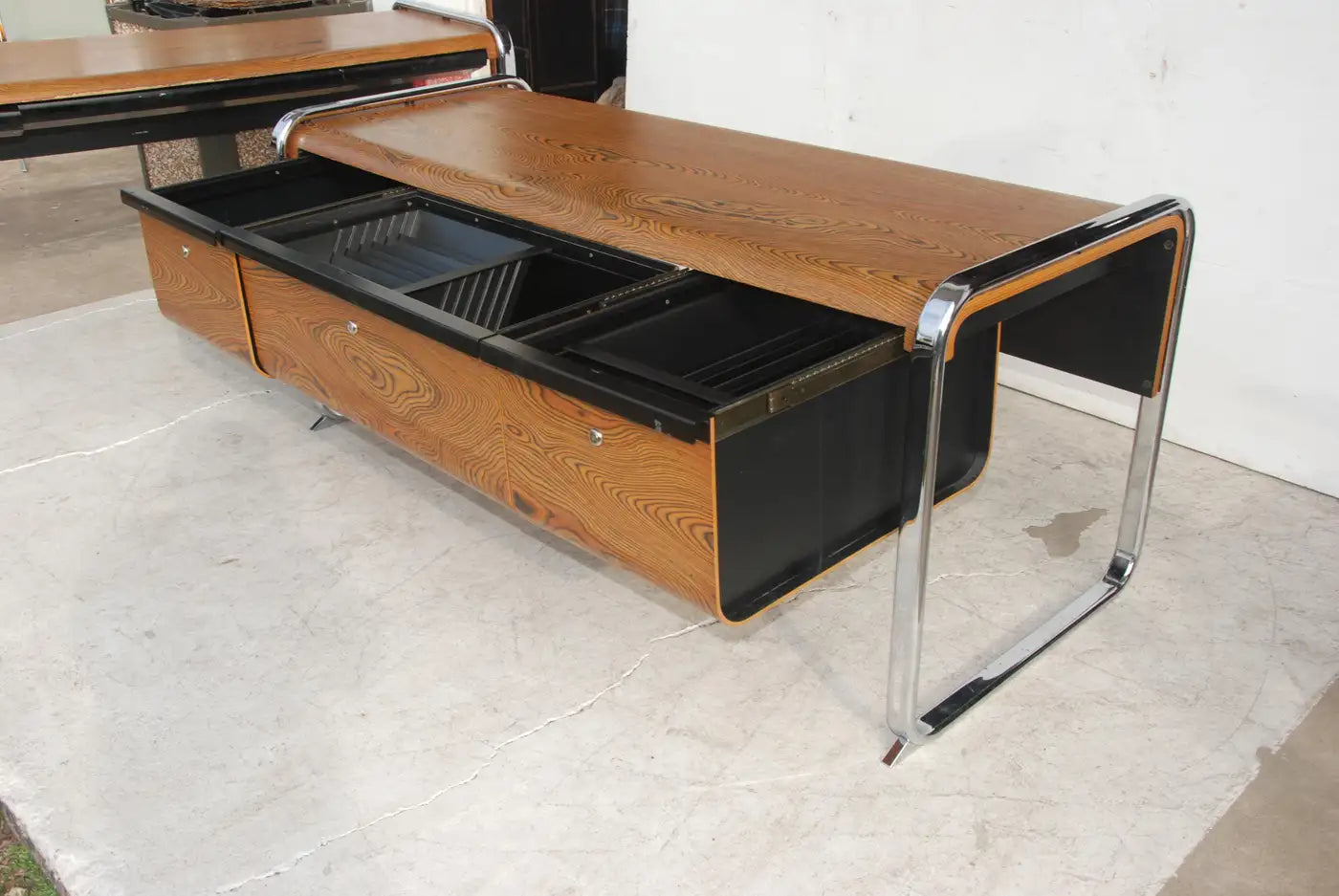 Stylish mid-century credenza with Zebrawood veneer and chrome