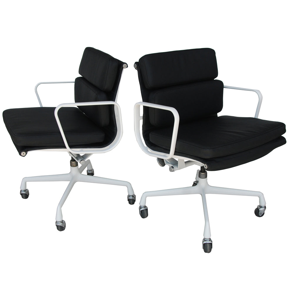 pair of Herman Miller chairs by Eames. Explore iconic mid-century design and exceptional craftsmanship in these classic seating options.
