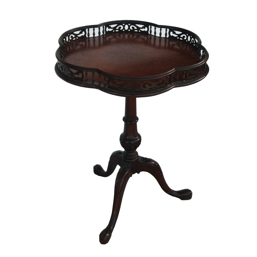 Antique mahogany side table with carved tripod base and gallery top