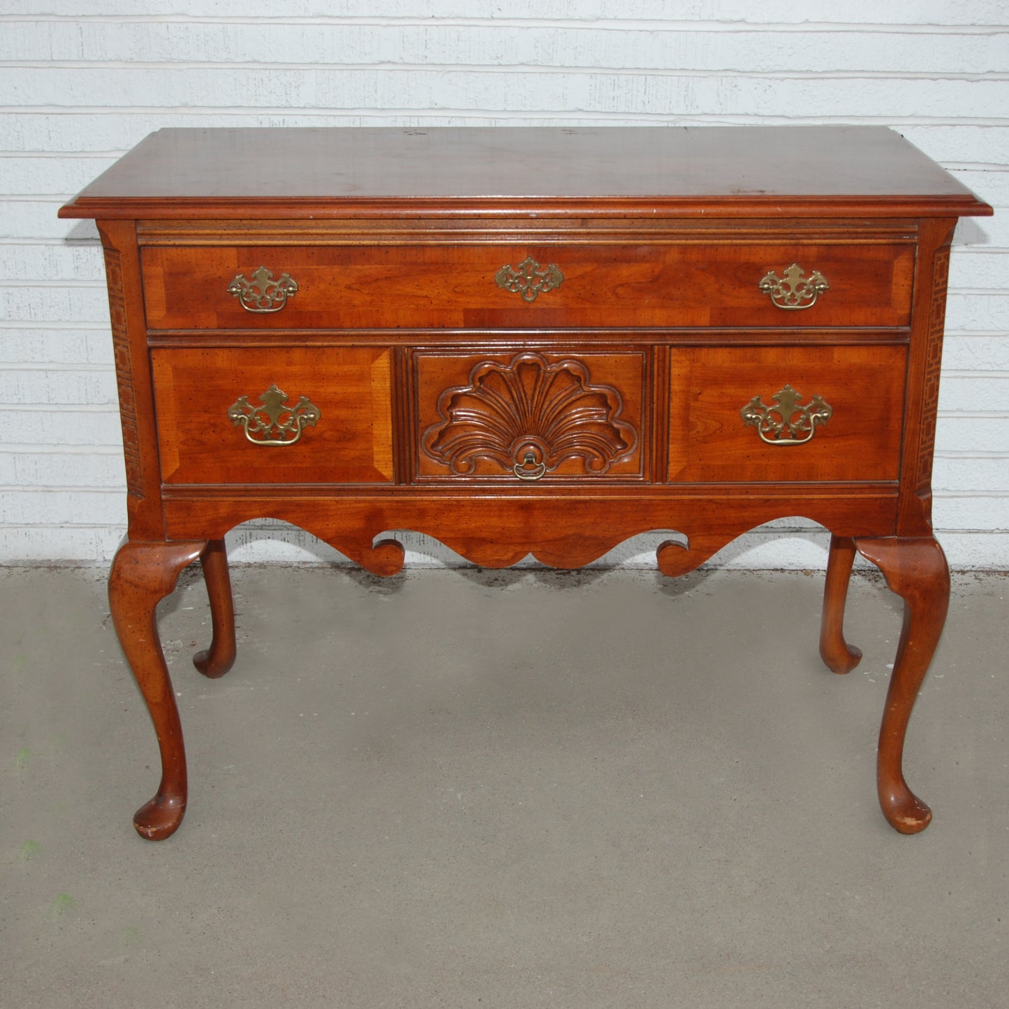 Contemporary Queen Anne style small credenza from Bassett Furniture with elegant traditional design