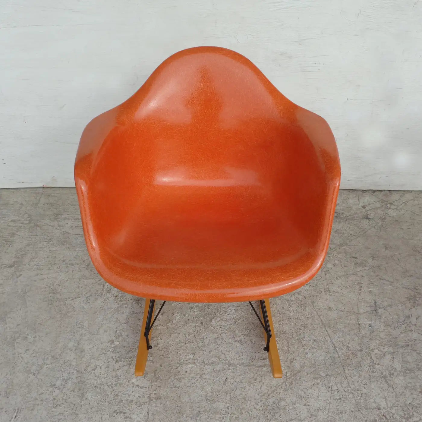 Eames fiberglass RAR rocking chair in orange