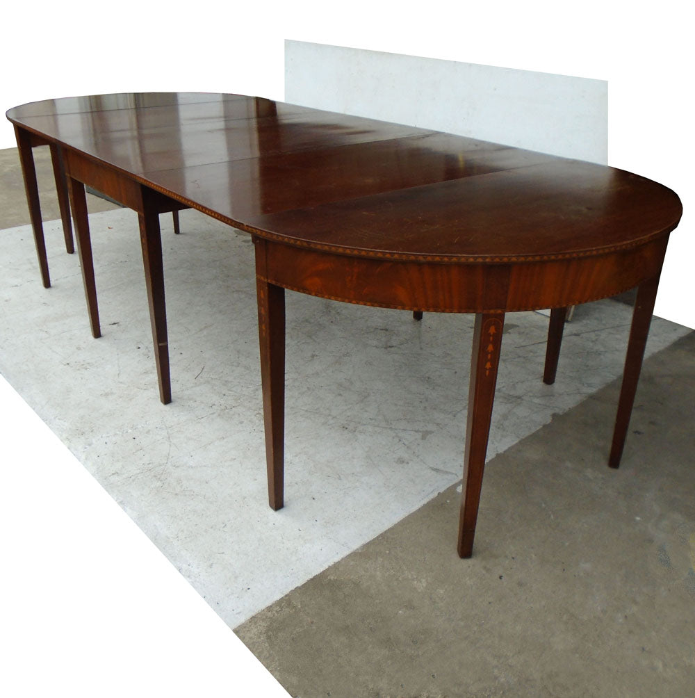 Vintage 120″ Hepplewhite-style mahogany dining table with antique finish and formal design