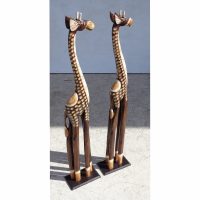 Natural wood giraffe sculptures standing tall