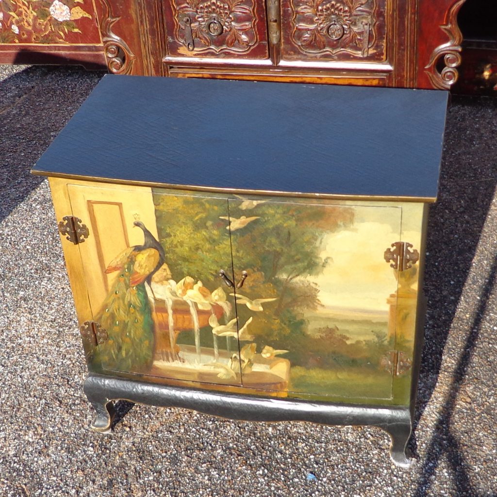 Decorative vintage cabinet with peacock artwork